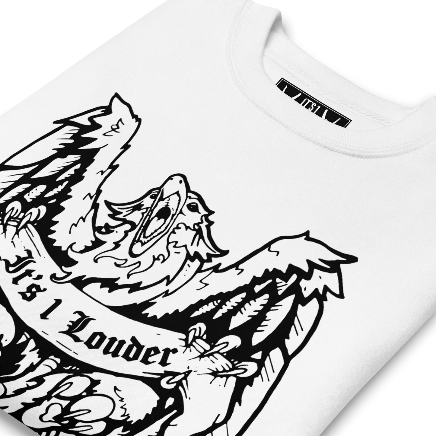 A white sweater with an image of a griffin which is a half-eagle half lion beast. The griffin has its wings spread wide and beak fully open. The entire graphic is in black. This sweater definitely is for someone looking for a rock n roll attire. Image is a close up of the front of the sweater where you see most of the griffin design and part of the inside label.