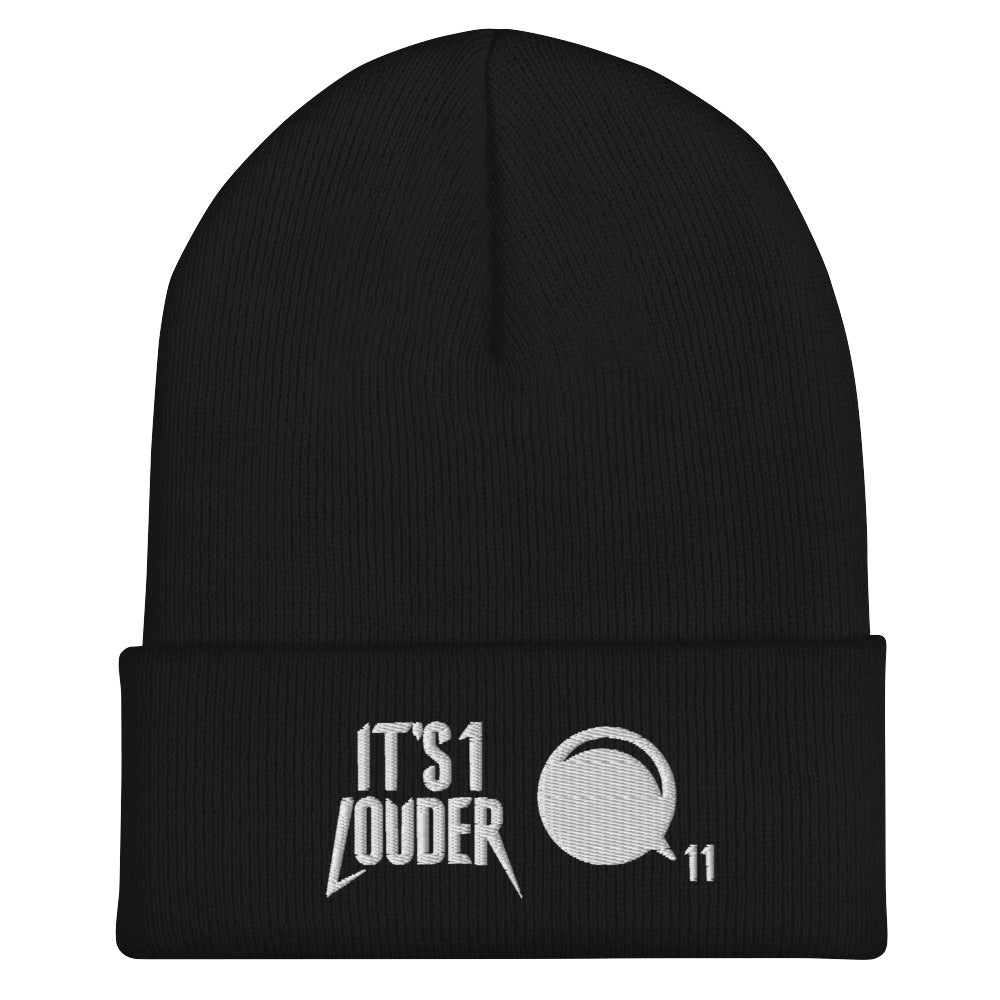 Black rock style cuffed beanie. On the cuff is written on the left side the words: It's 1 Louder. On the right of this is a graphic of a volume knob from a guitar or bass amplifier pointing to the number eleven.