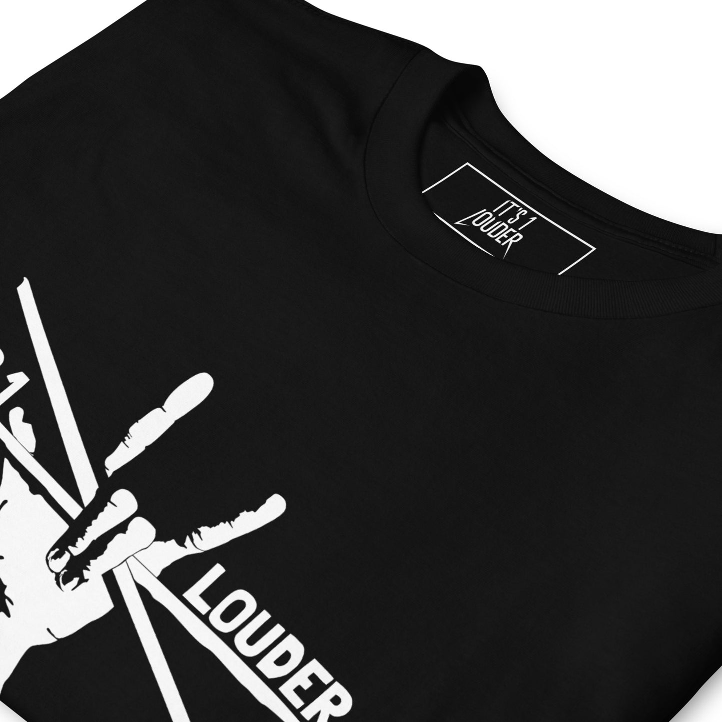 Close-up of the white drumsticks print and outer neck label on the black Drumsticks tee