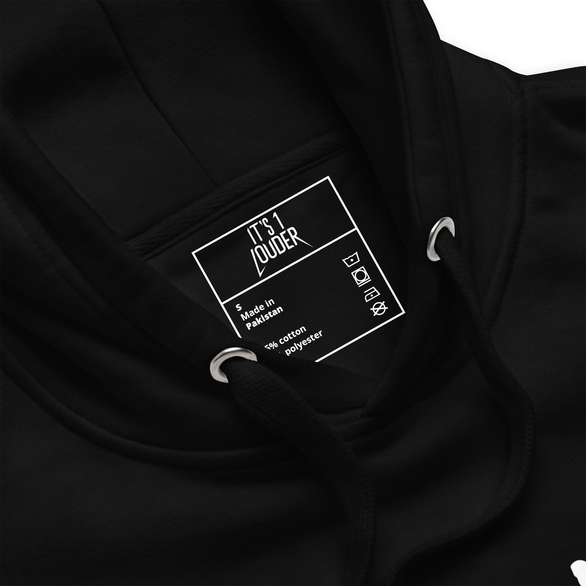 Close-up of the It's 1 Louder neck label inside the black Drumsticks hoodie