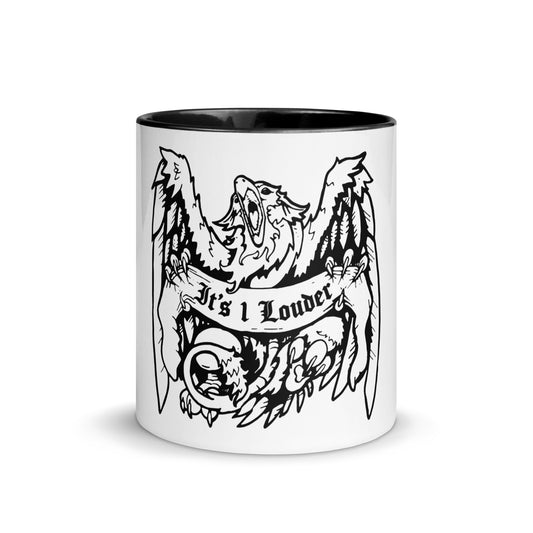 A white ceramic mug on the outside and black on the inside. The handle is also black. There is a design of a griffin (half-lion half-eagle creature) gripping a banner that says the words IT'S 1 LOUDER on it. It is a front view of the mug and griffin who has its beak wide open and both wings spread wide open. You also see the curled lion's tail. 